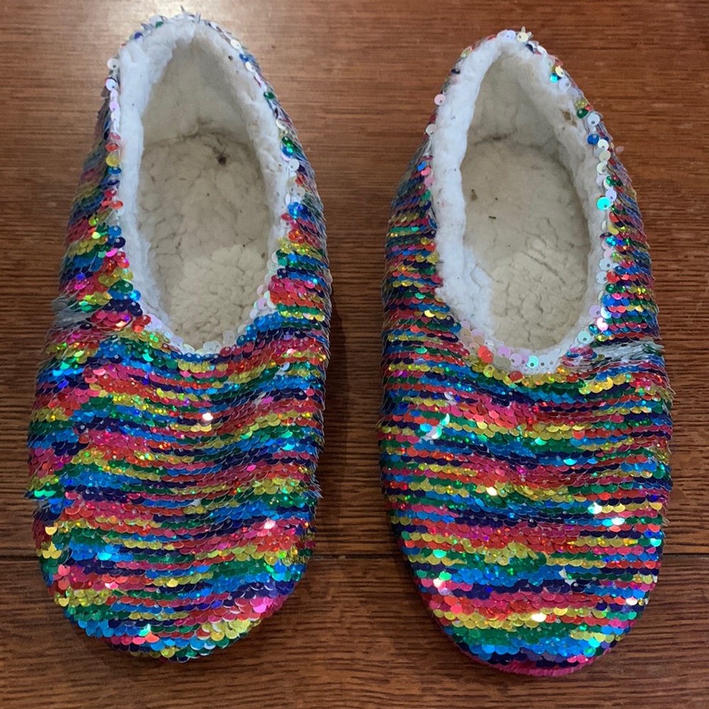 Sequence slippers with fleece inside. Well used and worn.
